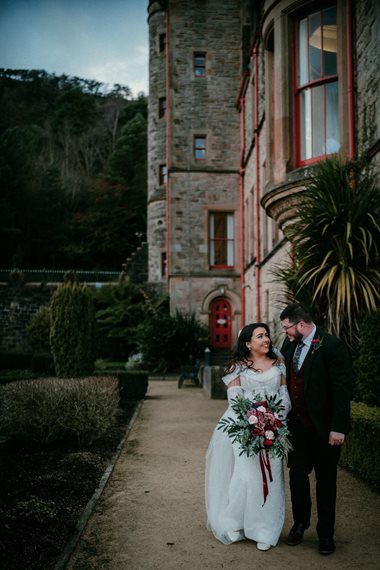 A wedding couple in the castle gardens